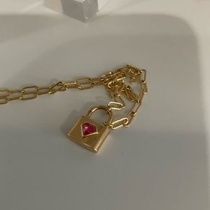 Paperclip chain with heart lock pendant